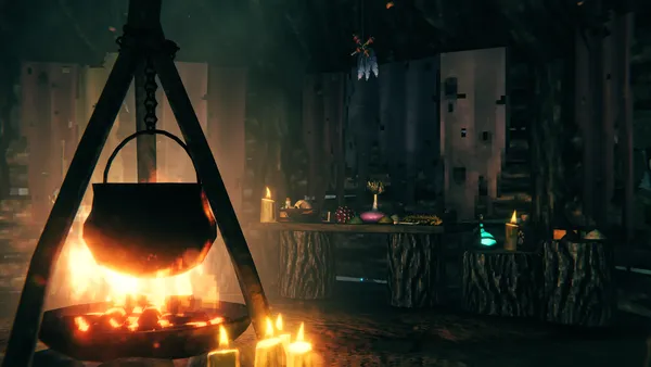 A Mead Ketill pot hanging over a campfire inside a dimly-lit Valheim cellar, with candles and brewing supplies nearby